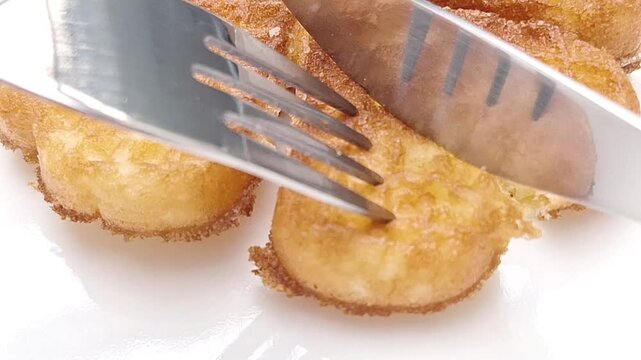 A delicious waffle cake lying flat and sliced on a white background