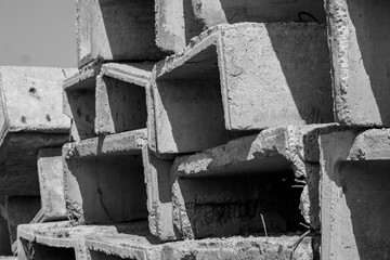 Concrete blocks in a construction site. Black and white photo.