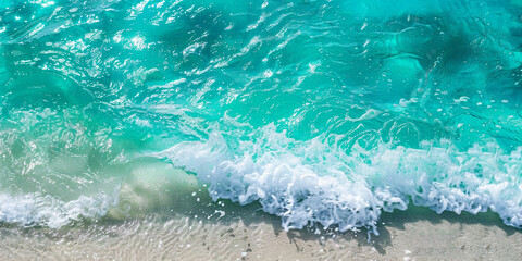 Turquoise sea waves gently breaking on a sandy shore.Turquoise Sea Waves Gently Breaking on a Sandy Shore


