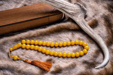Ottoman Amber Turkish Prayer Beads art. Natural amber stone prayer beads concept shooting.