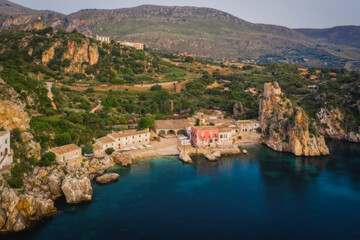 Wonderful Sights of The Stacks and Tonnara of Scopello Faraglioni e Vecchia Tonnara di Scopello , in Trapani Province, Sicily, Italy. June 2023, sunrise