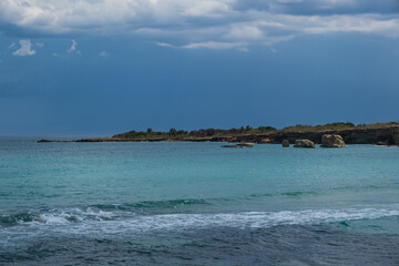 Landscape of a beautiful beach with clear and crystalline turquoise water and fine sand in Sicily in Syracuse called Fontane Bianche. June 2023