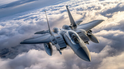 Military jet fighter aircraft soaring above the clouds at high altitude