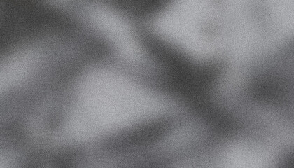 Abstract textured effect created by subtle interplay of light and shadow on grainy monochrome background