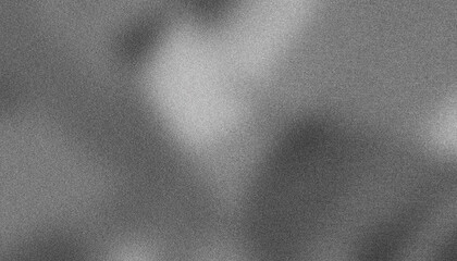Monochrome background texture with grainy abstract shapes formed by light and shadow, perfect for design projects looking for a textured and atmospheric vibe