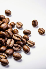 Roasted coffee beans on white background. Vertical banner