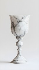 A goblet made from white marble showcases intricate details and smooth curves exuding luxury and sophistication
