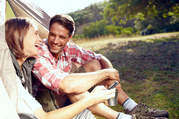 Couple, forest and camping with smartphone by tent for social media meme, funny video or connection in nature. People, happy and browsing phone on getaway with comic joke and internet fun on campsite