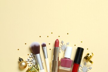 Flat lay composition with makeup products on color background. Space for text