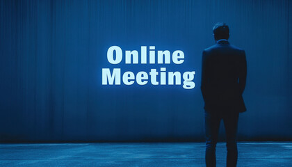 Silhouette of a man in a suit standing in front of a wall with 'Online Meeting' text, dim blue lighting creating a business-like and contemplative atmosphere.