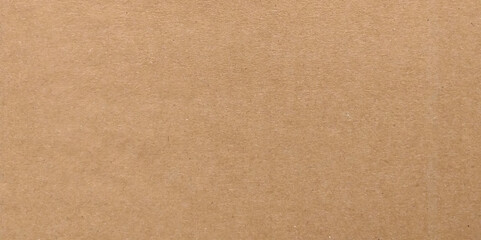 Brown cardboard sheet abstract background, texture of recycle paper box in old vintage pattern for design art work. Brown paper texture. Kraft paper for wraping