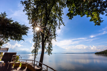 Natural background of clear sky, amidst the blue sky at the viewpoint, there are trees, sun, water...