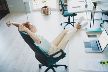 Above view portrait of corporate worker young stretching chair woman wear shirt business center...