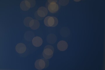 Golden blurred bokeh lights on color background. Glitter sparkle stars for celebrate. Overlay for your design