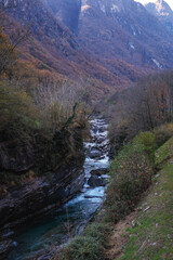 Serene River Flowing Through Autumn Valley