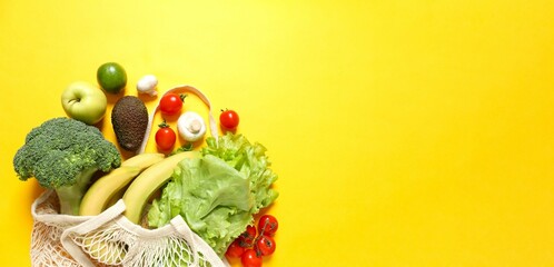 Clean healthy eating habits concept. Fruits, herbs, greens and vegetables mix, colorful juicy organic detox smoothie juice ingredients, color background. Vegan vegetarian diet food

