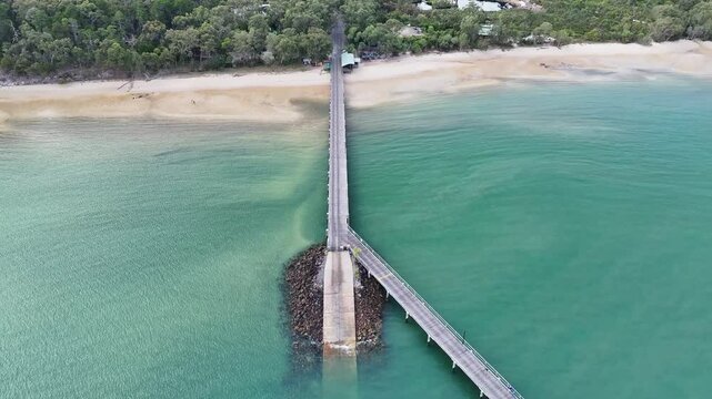 Fraser Island jetty pier, aerial drone, 4K video, K'gari, Queensland Australia, tourism tourist holiday vacation destination, ferry arrival departure
