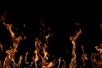 Bright orange flames rising on black background