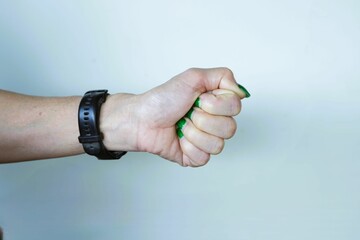 Fist punching through a wall as a symbol of power and success