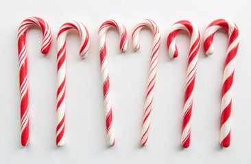 set of festive red and white candy canes, evoking the spirit of Christmas and sweet holiday treats. top view
