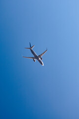 flying plane against the blue sky