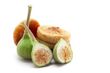 Close-up of organic, ripe, and raw green figs (Ficus carica or Anjeer) isolated on a white...