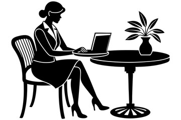 The woman is sitting at the computer