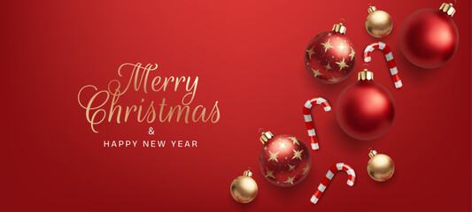 Merry Christmas and happy new year banner. Red and gold color glass sphere toys. Candy canes. Abstract background ideal for cards, posters, and celebrations. Not AI.