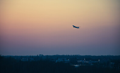 A plane taking of at sunset