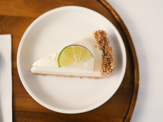 A tasty lemon cheesecake slice. Top view