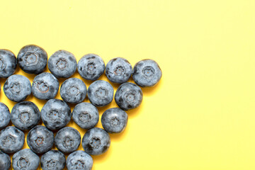 Fresh blueberry on yellow background	