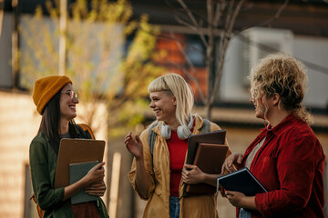 A Group of diverse students having fun outdoors in the city on a sunny summer day
