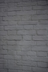Construction, unusual imitations and drawings on fabric, fabric material. Beautiful masonry of gray, white bricks on a fabric background.