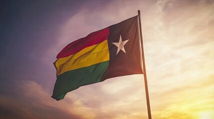 "The Ghana flag billowing gracefully against a stunning sunset, showcasing its vibrant stripes and star