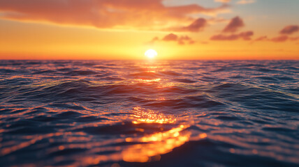 Obraz premium Majestic sunset casting golden hues over tranquil waves and a peaceful horizon