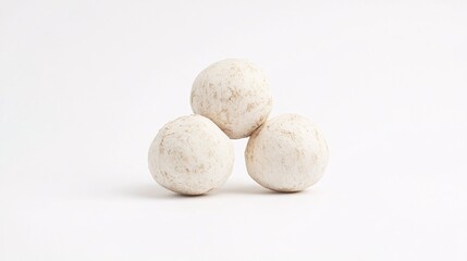 Fototapeta premium Three Textured White Spheres on a White Background: A Minimalist Still Life