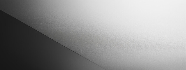 Minimalist close-up of matte gray fine grain paper featuring a subtle gradient and soft texture, ideal for backgrounds, stationery, and design projects.