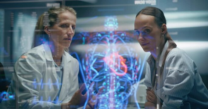 Physician And Patient Analyze Cardiac Hologram show AI Cardio Vascular Disease Prevention Analysis. Myocardial And Arterial Data, 4D Visualization Of Cardiovascular Rhythms For Precision Treatment
