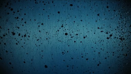 Raindrops creating patterns on a dark surface during a rainy evening