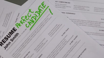 Fake mock CV (curriculum vitae) resume for John Smith, selected by HR as the perfect candidate for a job. Concept of job search, employee selection, recruitment process, work and hiring.