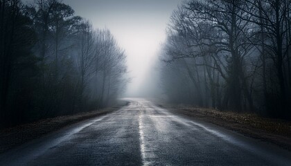 Long foggy mystery road in the dark woods