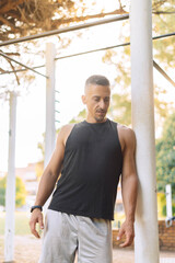 Man athlete, healthy, stand happy outdoor for workout, warm up and wellness. Portrait, confident male and trainer ready for training, fitness and enjoy health exercise.