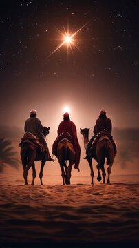 The three wise men from the east riding their camels following the star of Bethlehem through the desert, under a starry sky during Christmas