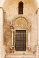 Fototapeta premium Entrance door of The Basilica of Saint Nicholas ( San Nicola ) in Bari, Roman Catholic Church in region of Apulia