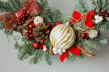 Christmas wreath with bows in red colors. Hand made work