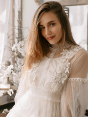 Fototapeta premium Portrait of beautiful woman with natural flawless skin, wearing vintage style dress.
