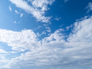 A beautiful sky with white clouds and vibrant blue. Ideal for backgrounds and nature-related themes.