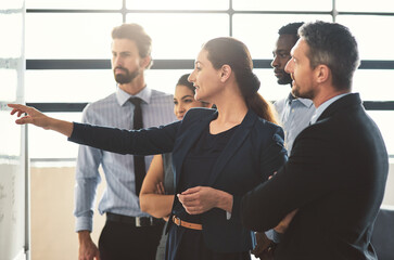 People, workshop and whiteboard in office for meeting, question feedback and problem solving. Woman...