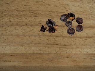 Roasted chestnuts on a wooden board. Roasted chessnuts are part of the Portuguese autumn and winter traditions.