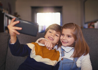 Selfie, bonding and children in home, smile and memory for siblings, boy and girl in living room and joy. Lounge, love and moment for kids, photography and embrace for care, happy and family in house